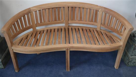 A hardwood garden bench W.160cm